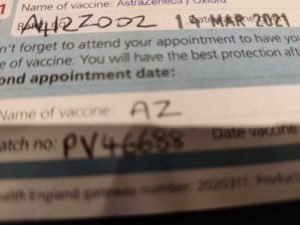 Covid vaccination card showing batch numbers