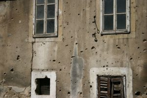 building in Mostar shows bullet holes from the last Bosnian conflict