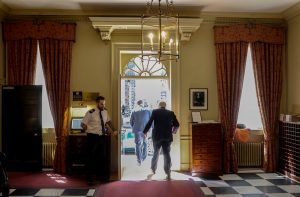 Johnson leaving Downing Street seen from within the building