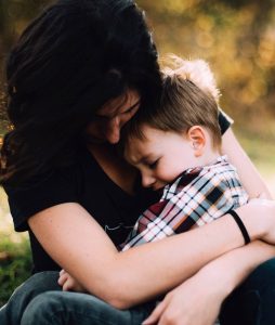 Mother holding upset child