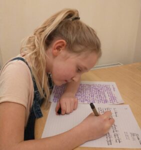 Anya writing her letter