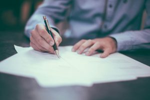 someone writing a letter